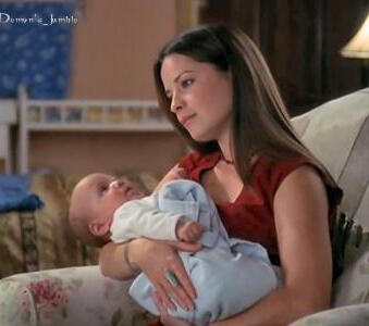Piper Halliwell holding an infant Wyatt Halliwell.